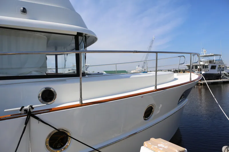 Slide: The Image of Beneteau Swift Trawler 44, 2020 model, docked at marina under clear blue sky. - 40