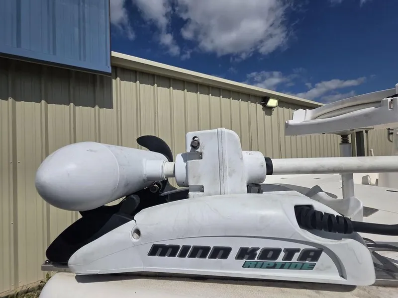 Slide: The Image of Minn Kota marine equipment on Blazer Bay 2420 Professional, 2008 model, under blue sky. - 12