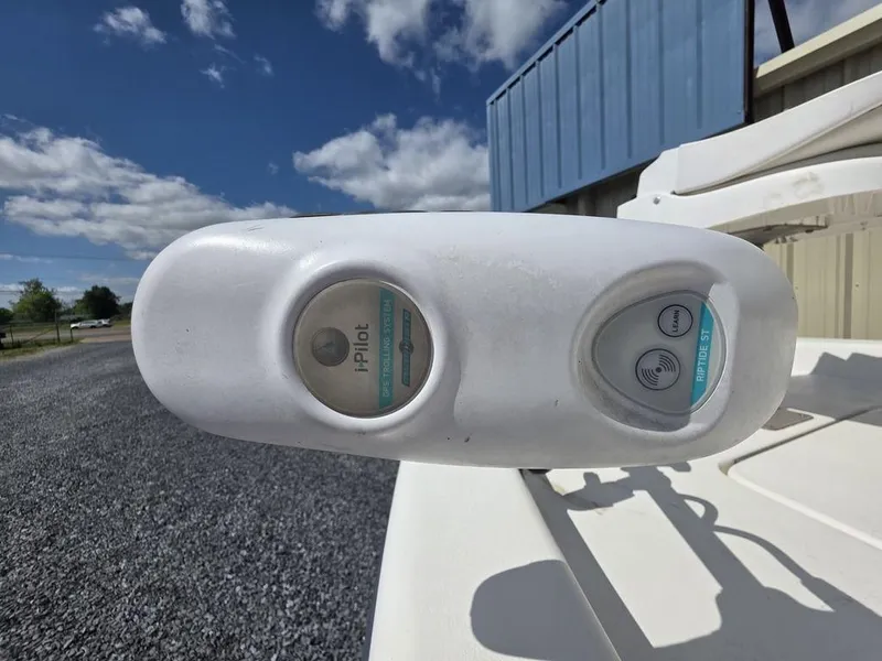 Slide: The Image of Control panel of a 2008 Blazer Bay 2420 Professional boat under a clear blue sky. - 13