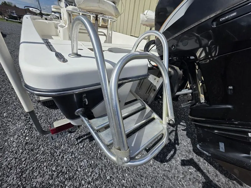 Slide: The Image of 2008 Blazer Bay 2420 Professional boat with metal ladder and outboard motor. - 15
