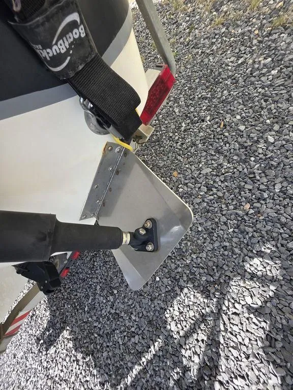 Slide: The Image of 2008 Blazer Bay 2420 Professional boat detail on gravel surface. - 16