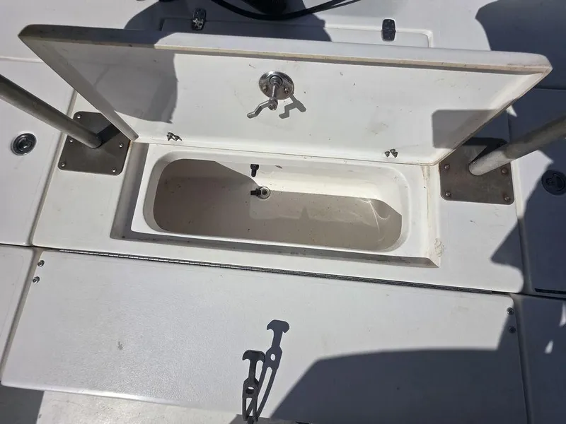 Slide: The Image of Open storage compartment on 2008 Blazer Bay 2420 Professional boat deck. - 21