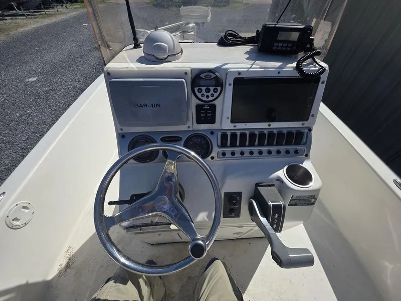 Slide: The Image of 2008 Blazer Bay 2420 Professional boat console with steering wheel and navigation equipment. - 23