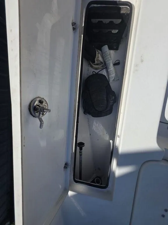 Slide: The Image of Open storage compartment in 2008 Blazer Bay 2420 Professional boat. - 30