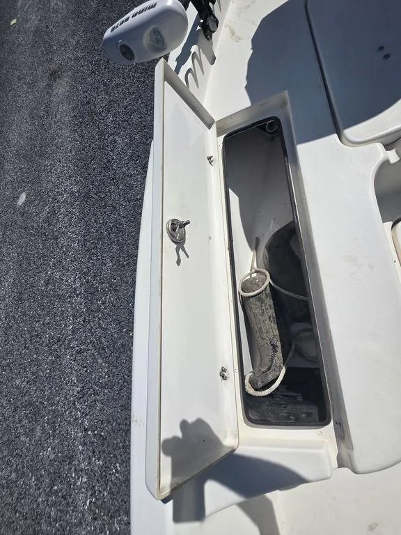 Slide: The Image of Open storage compartment on 2008 Blazer Bay 2420 Professional boat, showing interior details. - 32