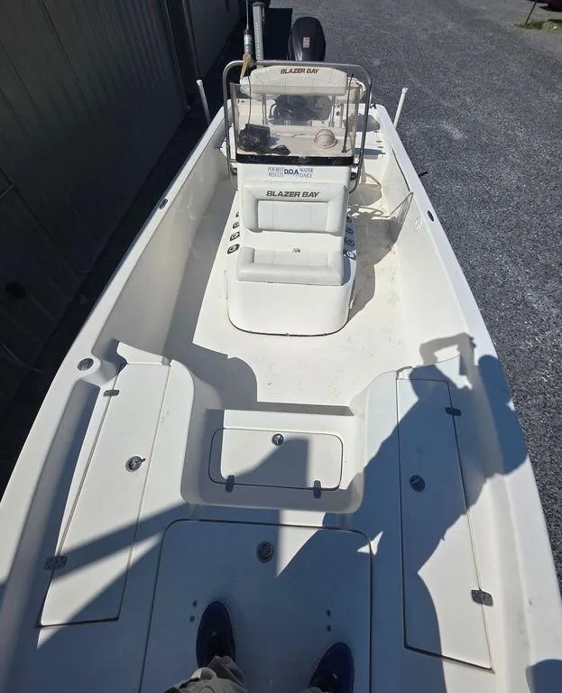 Slide: The Image of 2008 Blazer Bay 2420 Professional boat interior with console and seating. - 35