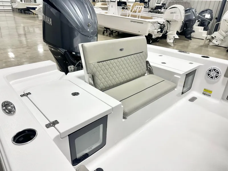 Slide: The Image of 2025 Sportsman Masters 247OE Bay Boat interior with cushioned seating and Yamaha engine. - 12