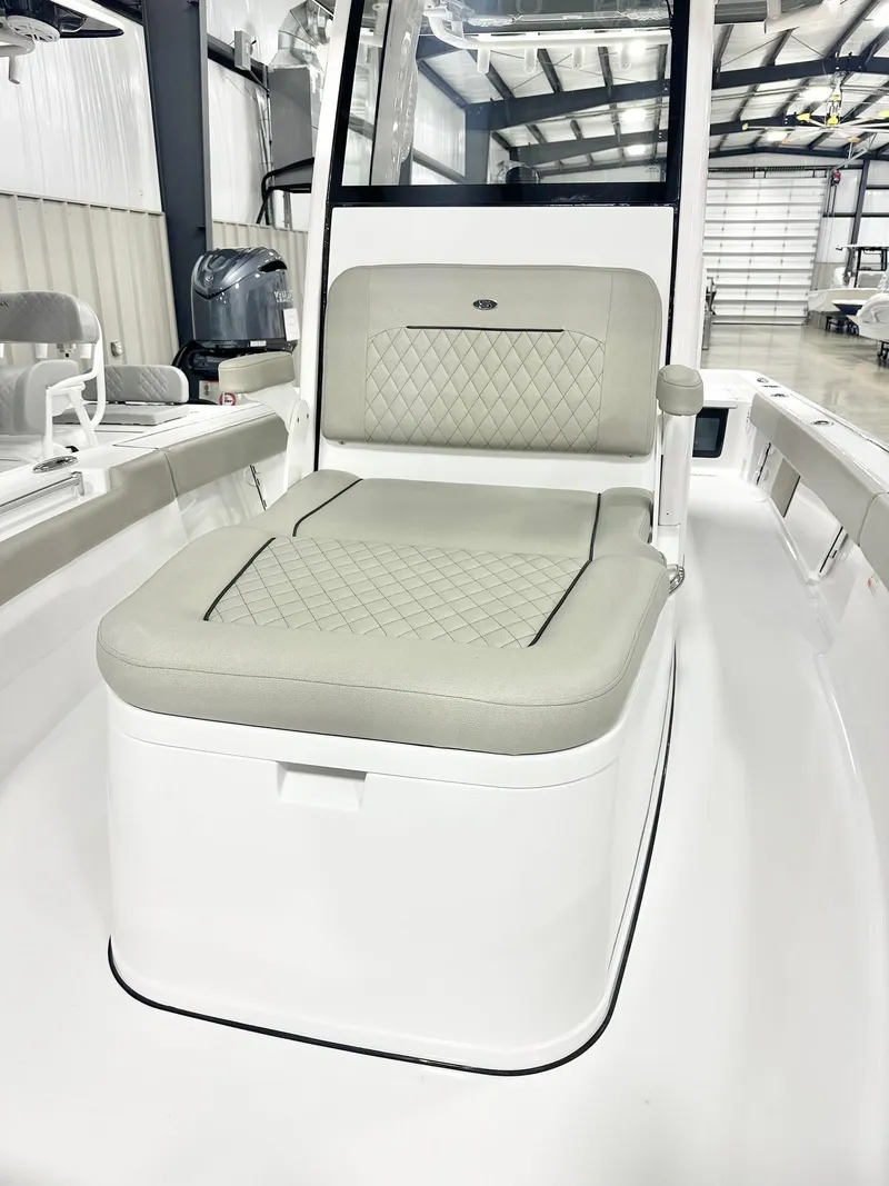 Slide: The Image of 2025 Sportsman Masters 247OE Bay Boat interior with cushioned seating in a modern design. - 9