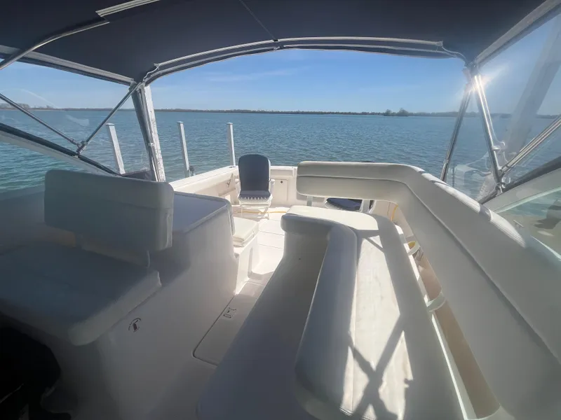 Slide: The Image of 2007 Tiara Yachts 2900 Coronet interior with seating, overlooking serene water view. - 13