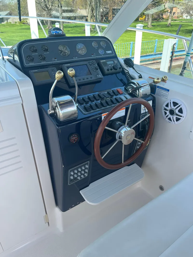 Slide: The Image of 2007 Tiara Yachts 2900 Coronet helm with steering wheel and control panel. - 17