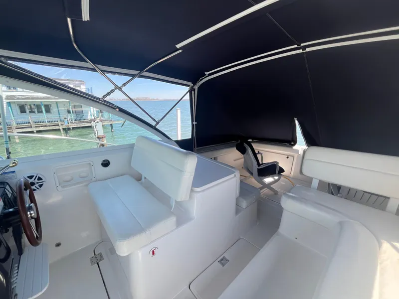 Slide: The Image of 2007 Tiara Yachts 2900 Coronet interior with seating and canopy, dockside view. - 18