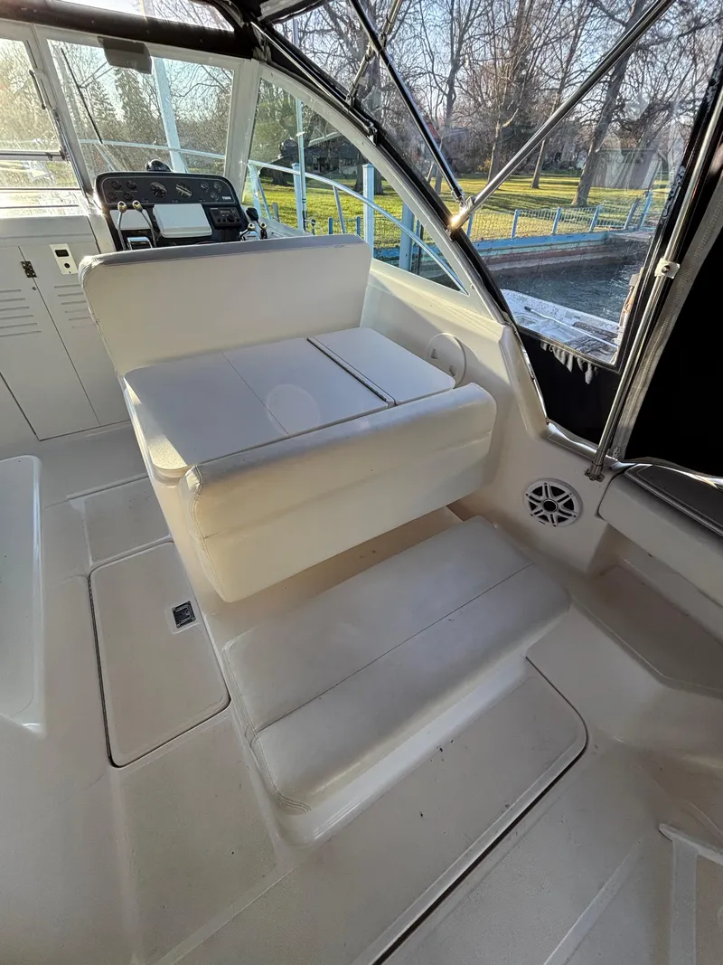 Slide: The Image of 2007 Tiara Yachts 2900 Coronet interior with helm and seating area. - 19