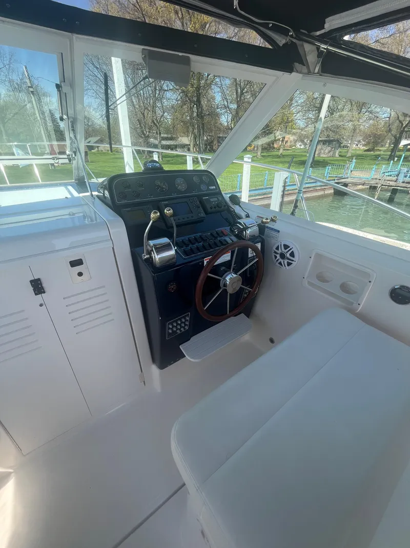 Slide: The Image of 2007 Tiara Yachts 2900 Coronet helm with steering wheel and controls. - 22
