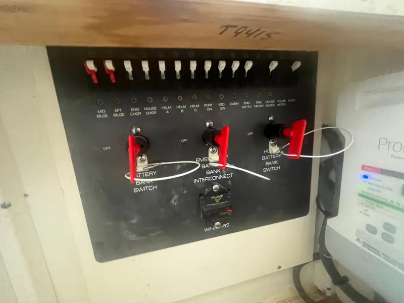 Slide: The Image of Electrical panel of a 2007 Tiara Yachts 2900 Coronet with switches and labels. - 35