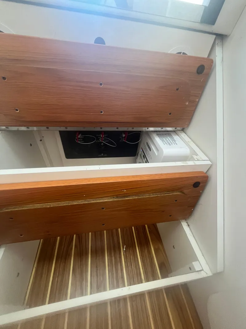 Slide: The Image of 2007 Tiara Yachts 2900 Coronet interior with wooden cabinetry and flooring. - 36