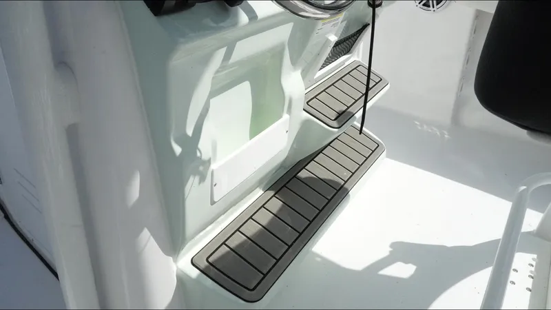 Slide: The Image of 2025 Tidewater 220 LXF boat interior with non-slip steps and sleek design. - 14