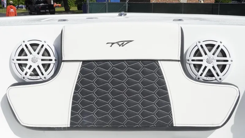 Slide: The Image of 2025 Tidewater 220 LXF boat interior with speakers and stylish upholstery design. - 17