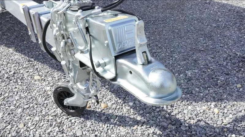 Slide: The Image of Trailer hitch of a 2025 Tidewater 220 LXF on gravel surface. - 23