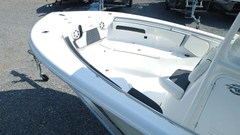 Slide: The Image of 2025 Tidewater 220 LXF boat interior with seating and speakers. - 27