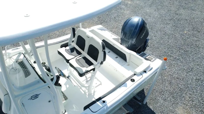 Slide: The Image of 2025 Tidewater 220 LXF boat with seating and outboard motor, viewed from above. - 28