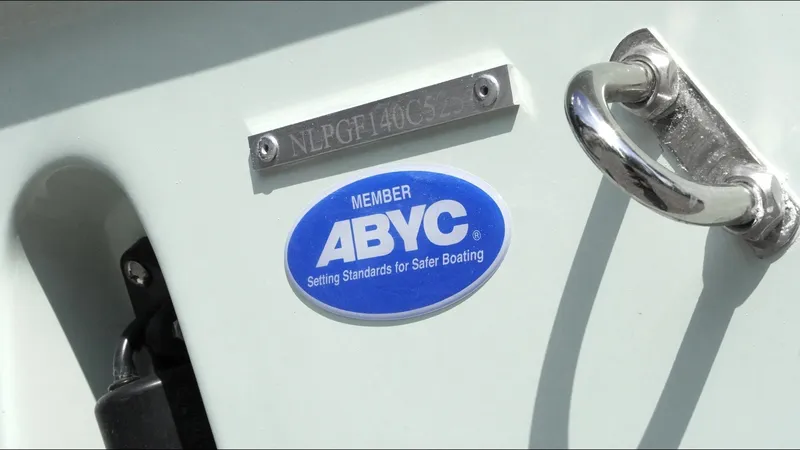 Slide: The Image of 2025 Tidewater 220 LXF boat with ABYC member badge for safety standards. - 30