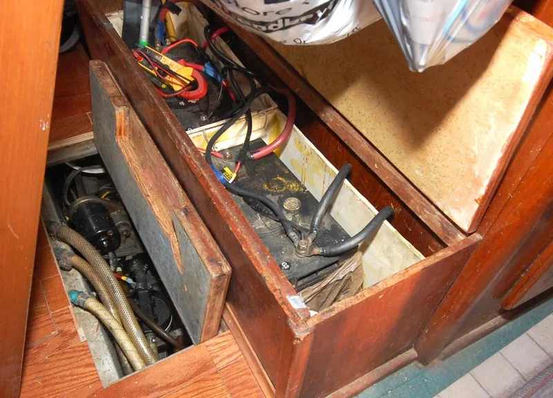 Slide: The Image of Battery compartment of a 1981 Endeavour 40 sailboat, showing wiring and connections. - 30