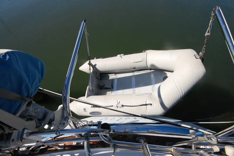 Slide: The Image of Inflatable dinghy attached to 1981 Endeavour 40 sailboat, viewed from above. - 6