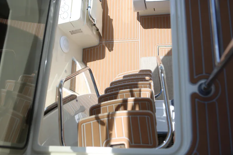 Slide: The Image of 2017 Beneteau Monte Carlo 4 yacht interior with sleek wooden flooring and modern design. - 10