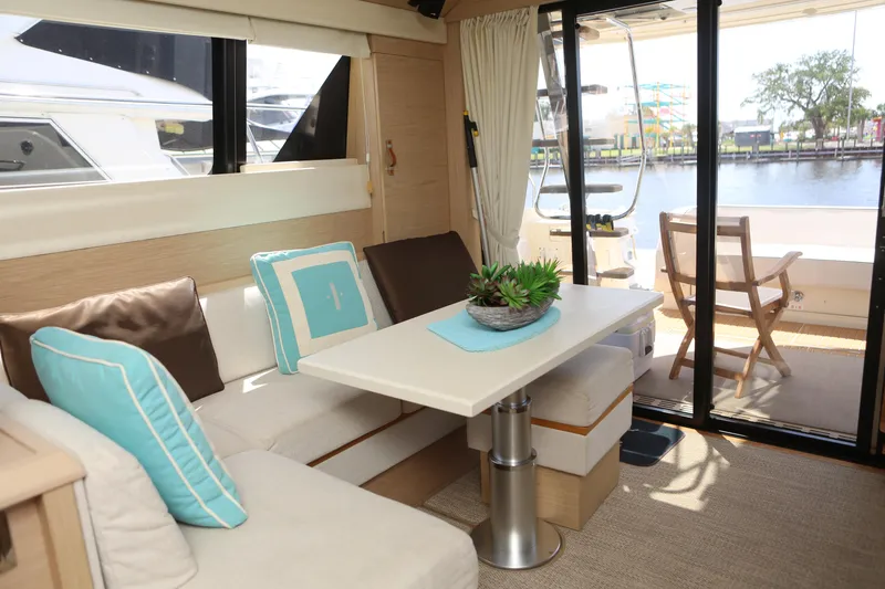 Slide: The Image of Interior of 2017 Beneteau Monte Carlo 4 yacht with cozy seating and table. - 12
