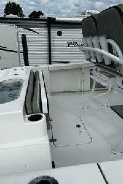 Slide: The Image of 2022 Sea Pro 219 Center Console boat interior with seating and storage. - 10