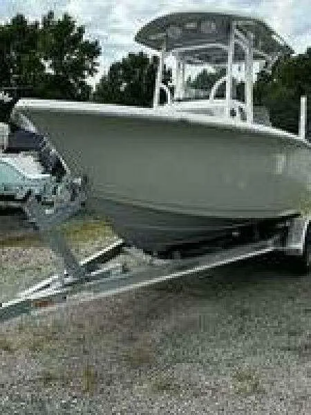 Slide: The Image of 2022 Sea Pro 219 Center Console boat on trailer, parked outdoors. - 13