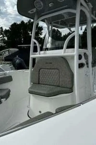 Slide: The Image of 2022 Sea Pro 219 Center Console boat with cushioned seating and sleek design. - 15
