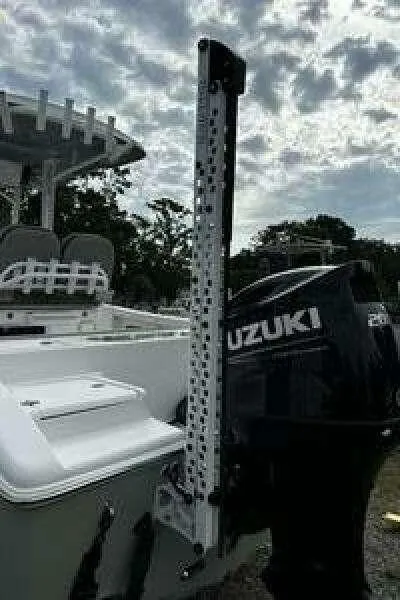 Slide: The Image of 2022 Sea Pro 219 Center Console boat with Suzuki outboard motor under cloudy sky. - 7