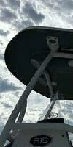 Slide: The Image of 2022 Sea Pro 219 Center Console boat against a cloudy sky. - 8