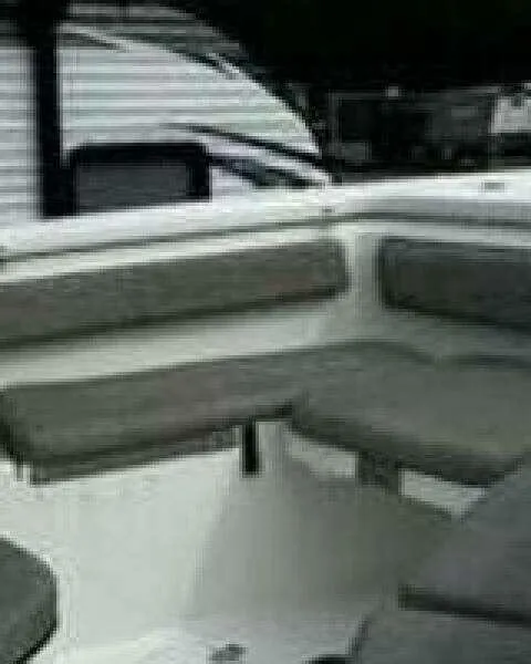 Slide: The Image of 2022 Sea Pro 219 Center Console boat interior with gray seating. - 9