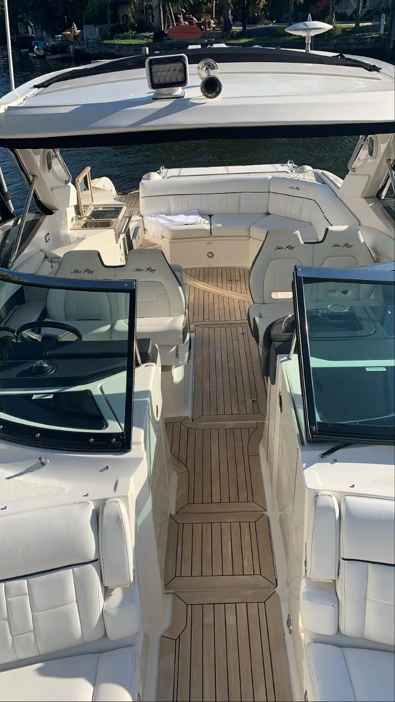 Slide: The Image of 2015 Sea Ray 350 SLX boat interior with luxurious seating and teak flooring. - 12