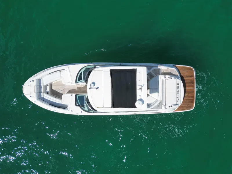 Slide: The Image of Overhead view of 2015 Sea Ray 350 SLX boat on clear green water. - 19