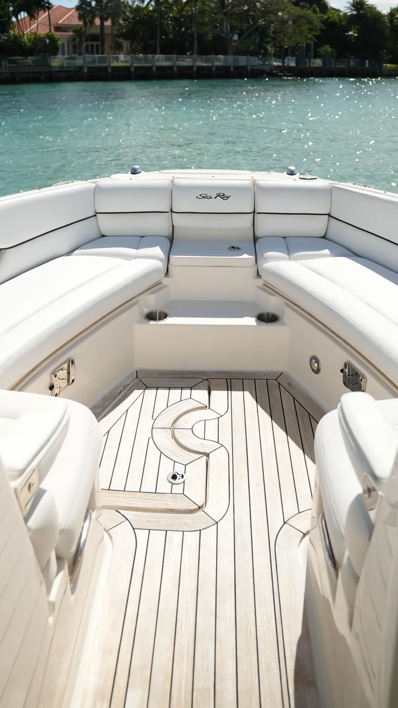 Slide: The Image of 2015 Sea Ray 350 SLX boat interior with elegant seating and wooden deck. - 25