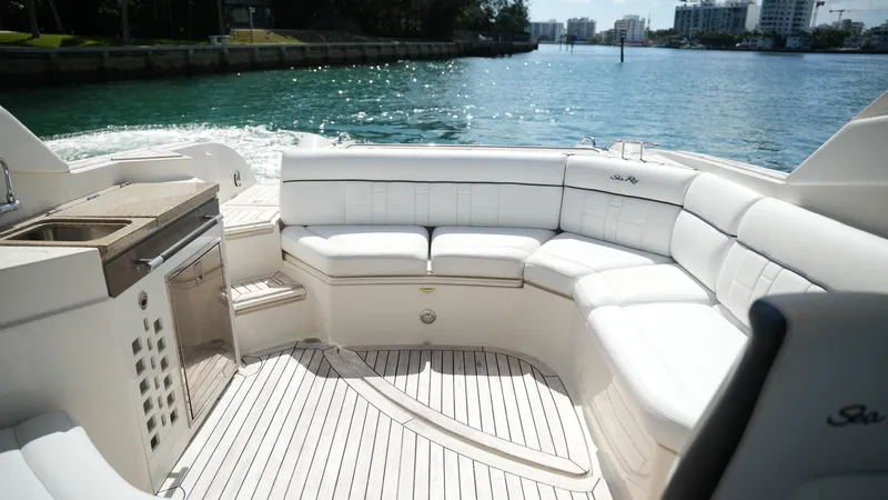 Slide: The Image of Luxurious 2015 Sea Ray 350 SLX boat interior with white seating and waterfront view. - 32
