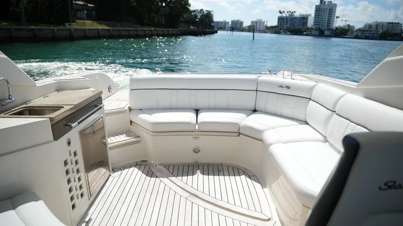 Slide: The Image of Luxurious 2015 Sea Ray 350 SLX boat interior with white seating and waterfront view. - 33