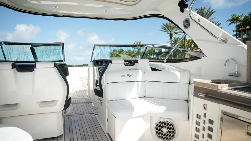 Slide: The Image of 2015 Sea Ray 350 SLX boat interior with white seating and modern amenities. - 36