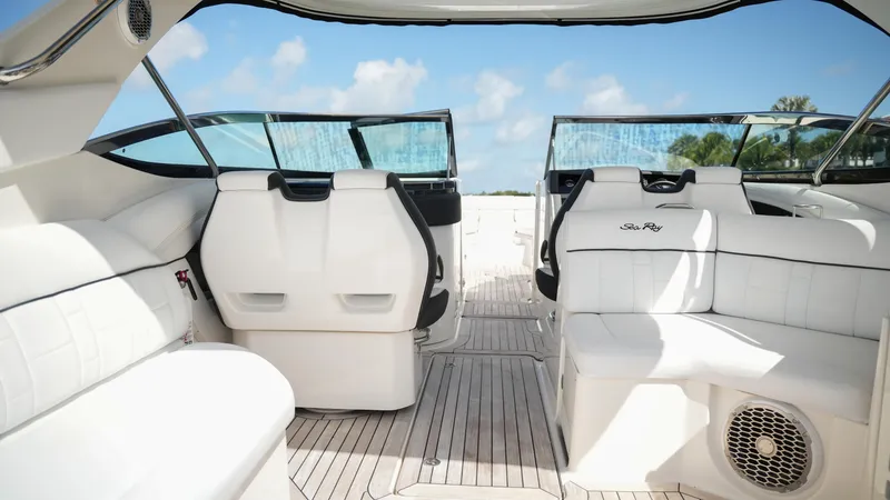 Slide: The Image of 2015 Sea Ray 350 SLX boat interior with white seating and open deck. - 37