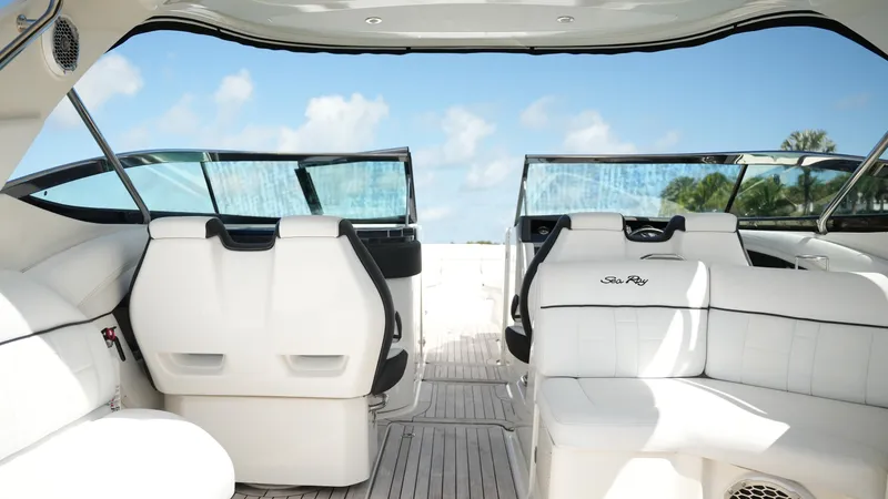 Slide: The Image of Interior of 2015 Sea Ray 350 SLX boat with white seating and open deck view. - 38