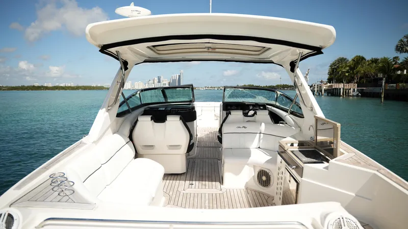 Slide: The Image of 2015 Sea Ray 350 SLX boat interior with seating, helm, and open water view. - 39