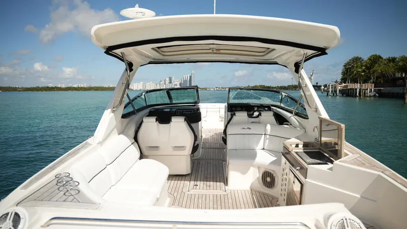 Slide: The Image of 2015 Sea Ray 350 SLX boat interior with seating, helm, and ocean view. - 40