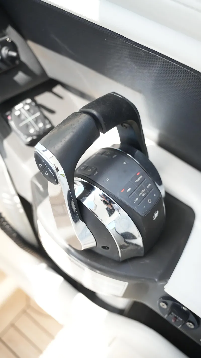 Slide: The Image of Throttle control of a 2015 Sea Ray 350 SLX boat, featuring sleek design and modern technology. - 45