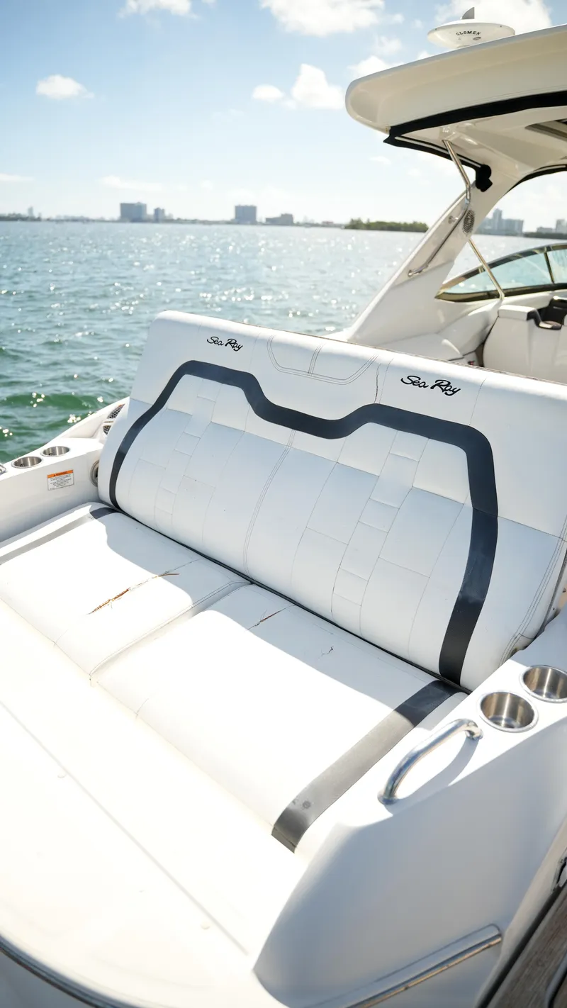 Slide: The Image of 2015 Sea Ray 350 SLX boat with luxurious seating on a sunny day. - 48