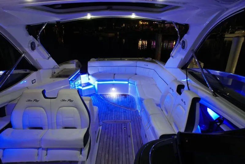 Slide: The Image of Luxurious 2015 Sea Ray 350 SLX boat interior with blue LED lighting at night. - 8