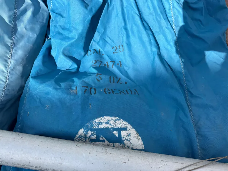 Slide: The Image of Blue sail with CAL 29 markings, model 1970, featuring a logo and text details. - 25