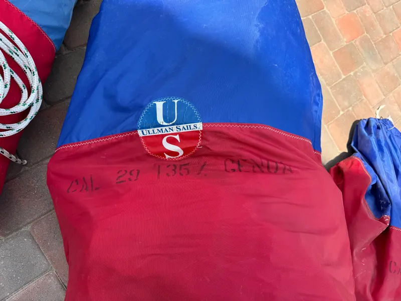 Slide: The Image of Red and blue Ullman sail bag for CAL 29, 1970 model, on brick surface. - 26